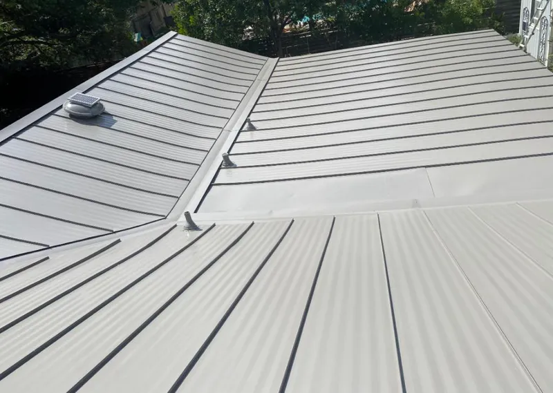 Solar attic fan installed on a metal roof for Roof Ventilation in Homeland Park